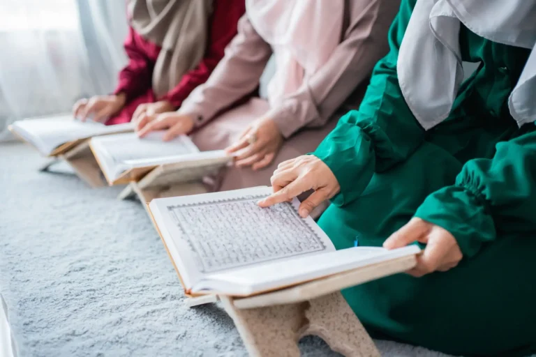 three-young-women-wearing-hijabs-read-holy-book-al-quran-together-1-min-scaled_11zon